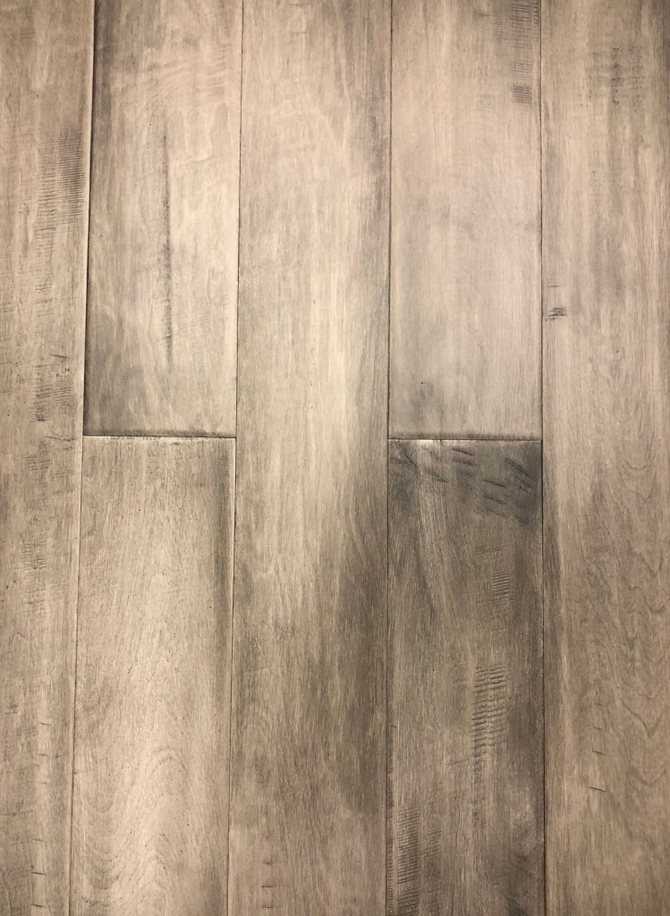 Light colored maple plank flooring to brighten living rooms in Toronto