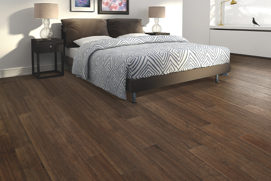 Cozy residential bedroom featuring premium dark hardwood flooring options from our Toronto selection
