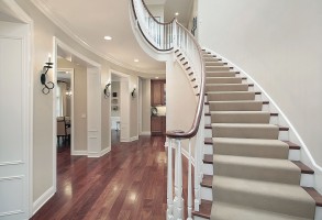 Close up of premium plush carpet installation on a classic residential staircase