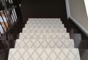 Geometric patterned staircase runner carpet installed by a professional Toronto gallery team