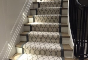 Close up of premium plush carpet installation on a classic residential staircase
