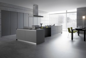 Sleek minimalist kitchen space showcasing large-format grey porcelain tile flooring
